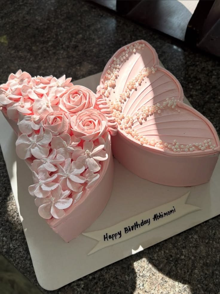 Blush double heart cake with piped roses and pearls