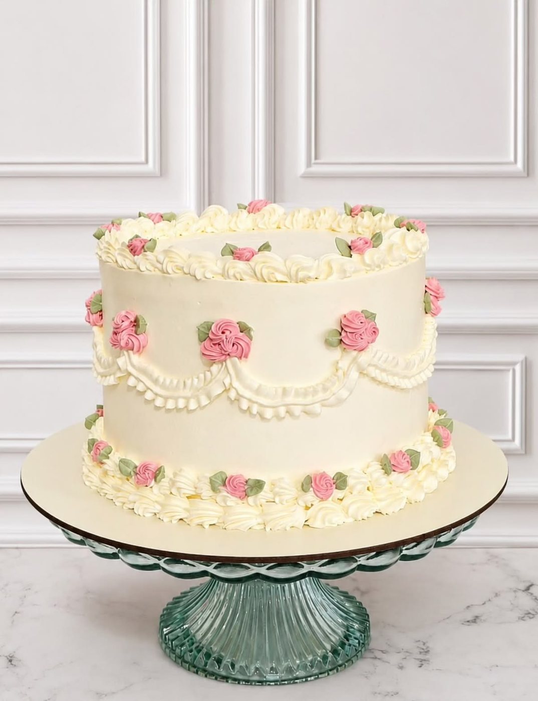 Vintage Lambeth cake piped in cream buttercream with pink roses